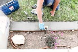 Add the wet concrete mixture to the forms, using a shovel to fill the forms to the top edge. Install Concrete Landscape Edging Aka Concrete Border Twofeetfirst