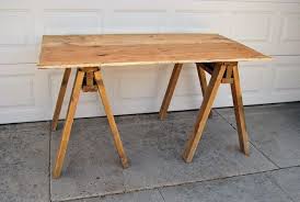 I had one of the nice home depot associates cut the top and bottom of the desk for me. How To Build A Sawhorse Table