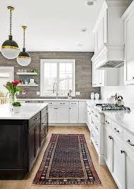The backsplash evolved from necessity, as a way to protect kitchen walls from damage. Gray Oak Plank Kitchen Backsplash Transitional Kitchen