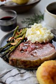 This herb and dijon wet rub creates a flavorful crust over the prime rib as it cooks and is perfect whether you bake, grill, rotisserie, or smoke the roast. Dijon Rosemary Crusted Prime Rib Roast With Pinot Noir Au Jus Simply Scratch