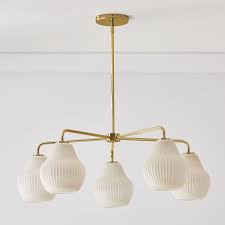 I mentioned in my renovation update last week (and also multiple times on snapchat) that we would be looking to swap out the existing light fixture. Sculptural Glass 5 Light Ribbed Chandelier Champagne