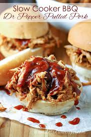 There's nothing like a lightly toasted bun piled high with tender pulled pork, slathered in a sweet and tangy sauce, and topped with crunchy slaw. Slow Cooker Dr Pepper Pulled Pork Let S Dish Recipes