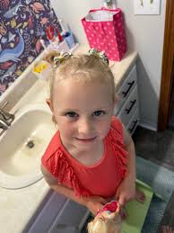 daughter notices pig with bow