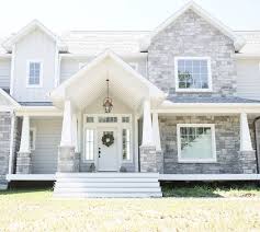 Love The White Front Door And Exterior Grey Stone The Exterior Stone Is Gray With No Stain Ohio Lim Gray House Exterior Exterior House Colors House Exterior