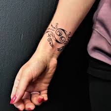 A tattoo that wraps around like a bracelet. Do Wrist Tattoos Hurt Or Damage Your Veins Tattoos Ideas And Artwork From Inkbykate