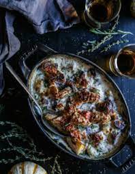 A delicious creamy potato side dish. Four Cheese Bourbon Potato Gratin The Curious Plate