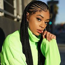 Jet black hair knotted in cornrows braids and secured on one side to create a graceful looking hairstyle. 50 Cool Cornrow Braid Hairstyles To Get In 2021