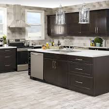 This light colored stone mosaic kitchen backsplash has just enough hints of brown to complement the dark brown cabinets. Shop For Cabinets Countertops Online Home Hardware