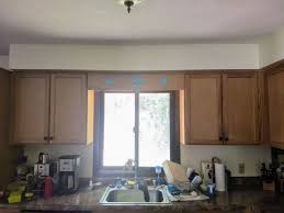 sconce light above the kitchen sink