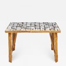 This mosaic bistro table is a great way to add a pop of color to a small home without overwhelming the space. Rattan Dining Table With A Ceramic Tile Top France C 1950