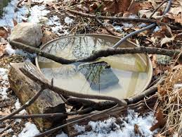 Make a birdbath that can thaw in winter with the help of a candle! Diy Heated Birdbaths Birdseed Binoculars