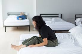 Old & young testing the bed. Mattress Buying Guide 2021 What To Look For When Choosing A Mattress Reviews By Wirecutter