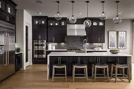 Dark Tones In A Modern Kitchen Give Off A Sense Of Sophistication And Elegance Wouldn T You Agree Modern Kitchen Modern Kitchen Remodel Kitchen Decor Modern