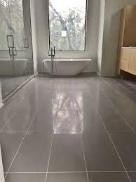 12x24 Porcelain Tile On Master Bathroom Floor Patterned Floor Tiles Floor Design Tile Floor
