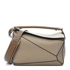 Hi everyone, welcome back!in today's video, i am reviewing my loewe puzzle bag in size medium, and whether it's worth the money. Loewe Calfskin Medium Puzzle Bag Sand Mink 643924 Fashionphile