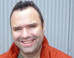 Q: Who IS that? A: Tom Collins, music lover and all-around great guy