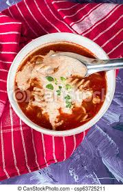 Tomato soup is a soup with tomatoes as the primary ingredient. A View Of A Bowl Of Tomato Soup With Sour Cream A View Of A Bowl Of Tomato Soup With Sour Cream On A Colored Background Canstock