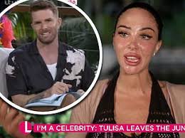 I'm A Celeb star Tulisa fails to greet her evicted campmate Melvin Odoom as  he arrives back at Australia hotel