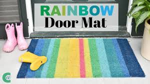 I'd recommend first adding a carefully measure the space in between the shapes so that the finished product looks how you want. Spray Painted Rainbow Doormat For Spring Youtube