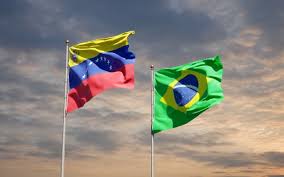It was delimited by the treaty of limits and river navigation of may 5, 1859 and ratified by the protocol of 1929. Premium Photo Beautiful National State Flags Of Venezuela And Brasil Together On Blue Sky