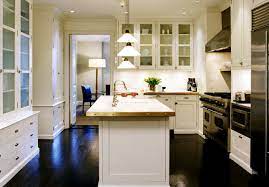 The gray island is a needed contrast to the dark wood flooring. White Kitchen Cabinets With Dark Wood Floors Cottage Kitchen Nathan Egan