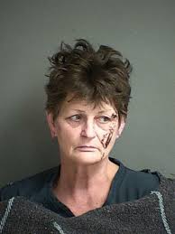 Douglas County woman accused of brutally beating 94-year-old neighbor with  flashlight, police say
