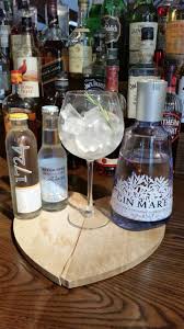 Gin Mare A Mediterranean Inspired Product That Uses Olive Basil Rosemary And Thyme The Citrus Elements Lemon Orange And Mandarin Orange Wheels Aromas Gin