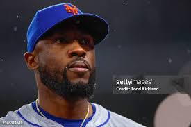 Ed Mangan, Senior Director of Field Operations helps his crew tend to...  News Photo