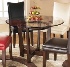 Signature Design By Ashley Charrell Medium Brown Round Dining Room Table Reviews Goedekers Com Round Dining Room Round Dining Table Contemporary Dining Room Sets