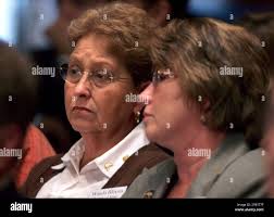 Wanda Blevins, whose husband Dave Blevins died at the Jim Walter Resources  Blue Creek No. 5 Mine in Brookwood, Ala. left, listens to testimony