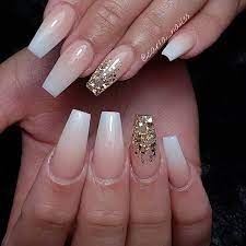 The slight gold detailing has made this nail design even mesmerizing. Black White And Gold Nail Ideas Novocom Top