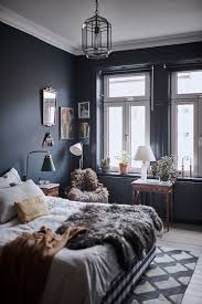 The moody blue design trend is sure to be seen for a long time yet, as blue is such a varied colour to work with and can be used in many rooms of the house, not just the bedroom. A Vintage Scandinavian Apartment With Dark Blue Bedroom The Nordroom