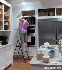 Cabinets can be customized to fit an individual's needs in more ways than one. Lift Up Cabinet Doors Sawdust Girl