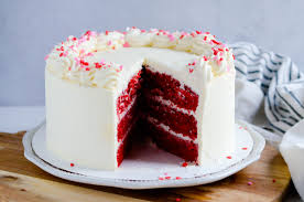 Add the dry ingredients to the bowl in batches, alternating with the red buttermilk, mixing until well combined. Red Velvet Cake With White Chocolate Frosting Recipe Something Swanky