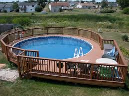 Swimming Pool Wooden Pool Deck And Railing Also Patio Chairs Around Round Above Ground P Swimming Pool Decks Pool Deck Plans Above Ground Pool Decks