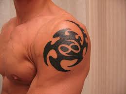 Cancer ribbon with cross tattoo on back shoulder for guys. Cancer Tattoos Designs Ideas And Meaning Tattoos For You