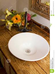 retro bathroom bowl sink, faucet, and