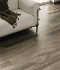 Porcelain tiles can be made to look like anything, meaning tile manufacturers can create wood looks that cannot be found in nature (fore example, purple or lime green wood planks) or duplicate the look of exotic woods without the high cost or environmental impact. 4 Reasons To Choose Porcelain Wood Tile Over Hardwood Floors Conestoga Tile House Flooring Home Flooring