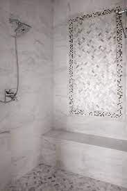 Amazing Master Shower Features Carrera Marble Tiled Surround Accented With A Mosaic Marble Inset Tiles Above A Ca Shower Tile Shower Accent Tile Marble Showers