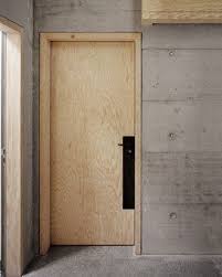 Light Unfinished Wood Door Concrete Walls Deep Black Contrast On Accessories Doors Interior Concrete Interiors Plywood Interior