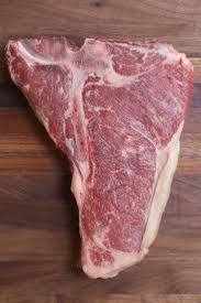 Overhead View Of A Raw Tbone Steak Showing The T Shaped Bone In The Middle With The Striploin On The Right T Bone Steak Tbone Steak Recipe Cooking T Bone Steak