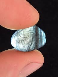 A Saffordite Exhibiting Non Parallel Banding One Of The Rarest Traits The Stone Looks Opaque Black Under Normal L Unique Items Products Stone Jewelry Jewelry