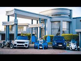The woman is elva shartel ferguson and the boy is walter ferguson; Shona Ferguson Shows Off His Mansion And Car Collection