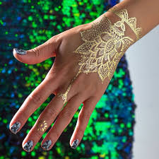 Gold Temporary Tattoo With Intricate Pattern On A Hand With Marble Like Nail Polish In Light And Dark Blue Mock Henna In 2020 Hand Henna Henna Tattoo Henna Tattoo Hand