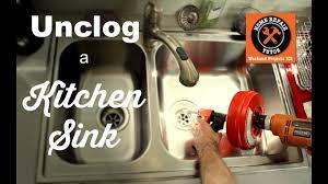 When it does, the rotating tip will either break it up as it moves down the pipe or grab hold of the gunk so that you can pull it out. How To Unclog A Kitchen Sink Drain By Home Repair Tutor Youtube