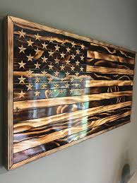 This American Flag Is Made From Pine And Is Burned To Bring Out The Unique Grain In Each Piece The Stars Are Hand Eng American Flag Wood Wood Flag Wooden Flag