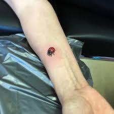 Tattoos ladybug improvise with the elements of nature. Flower Tattoo Wrist Female Tattoo Designs Novocom Top