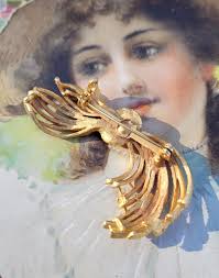 Broche vintage com strass falso pérola dourada arco meados do século