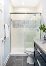 Dark Gray Floor Tiles Accent A Dark Blue Bath Vanity Fitted With Polished Nickel Pulls And A Light Gray Q Dark Gray Bathroom Grey Bathroom Floor White Bathroom