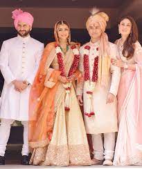 Saif And Kareena Pose With The Newly Weds Soha And Kunal Indian Wedding Outfits Soha Ali Khan Wedding Indian Groom Wear